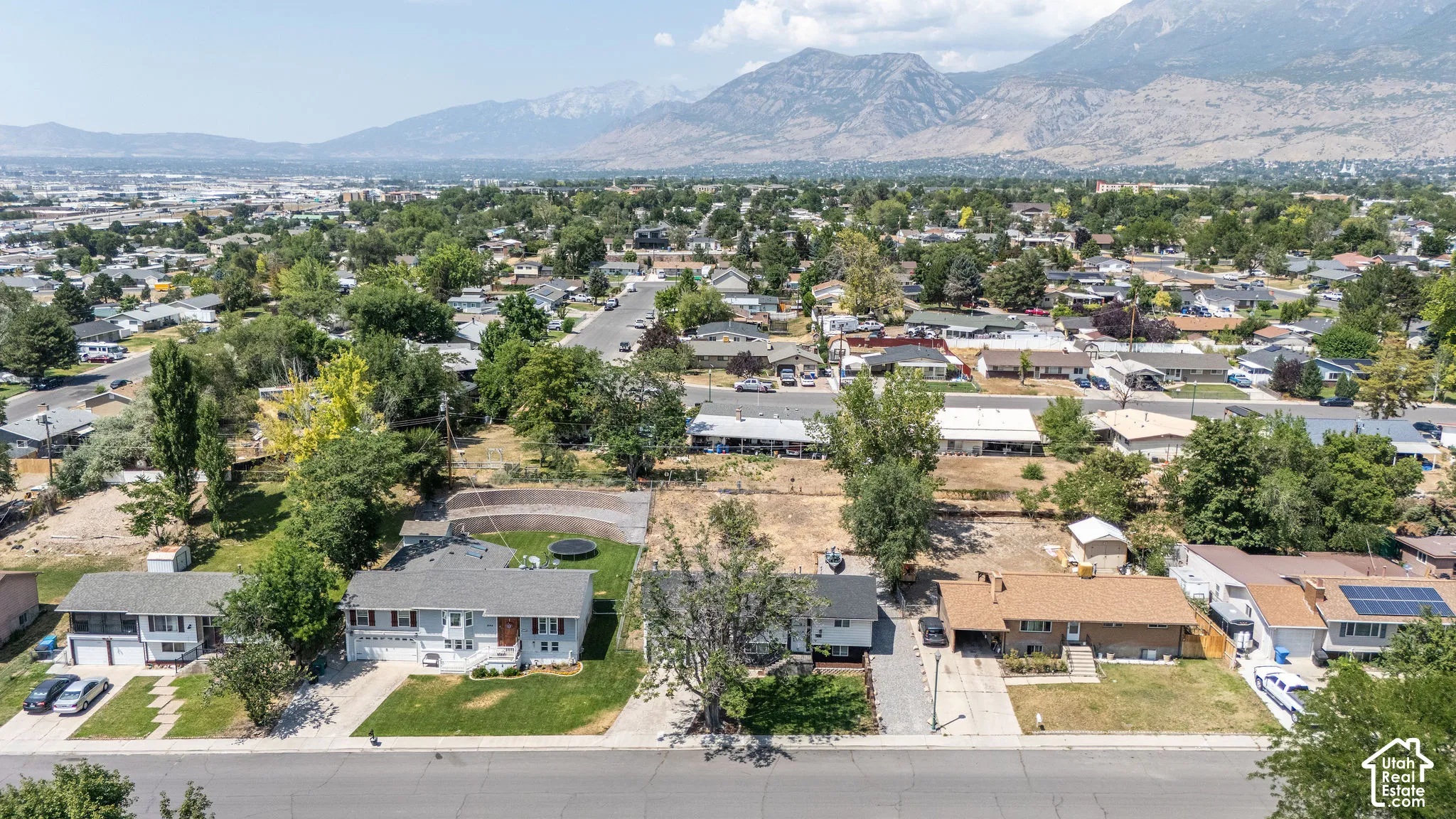 Expansive aerial view of a residential neighborhood with distant mountains