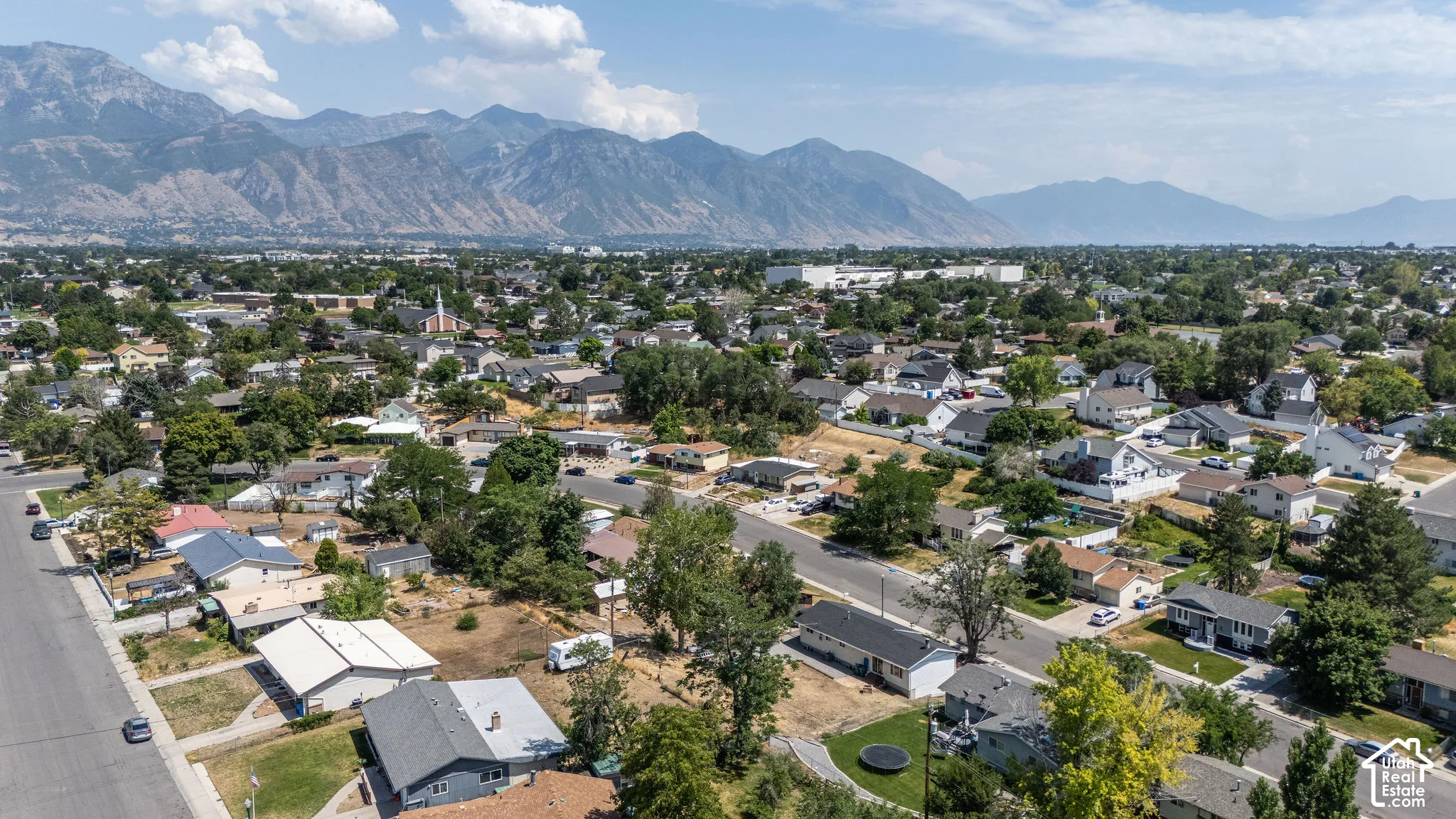Expansive residential neighborhood featuring a variety of single-family homes with pitched roofs