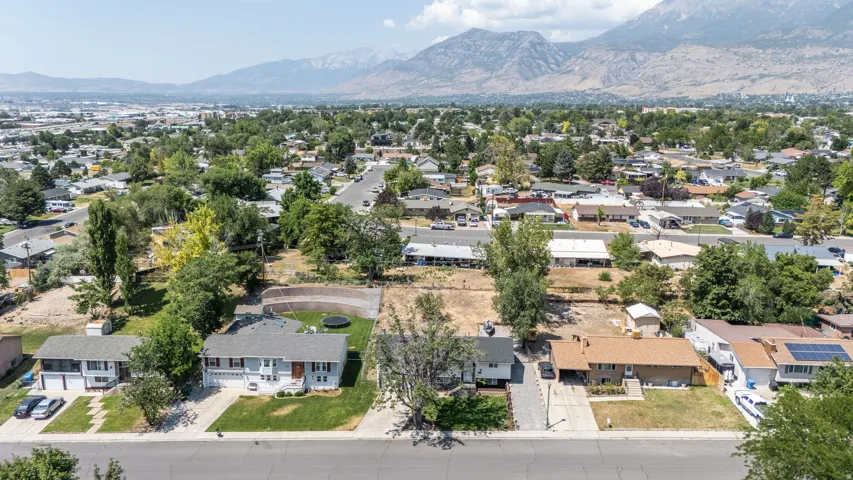Expansive aerial view of a residential neighborhood with distant mountains