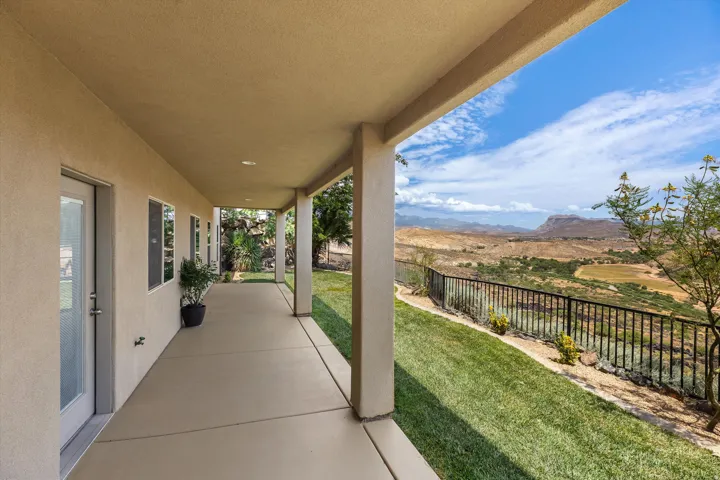 Covered patio with recessed lighting, stucco exterior, and concrete flooring