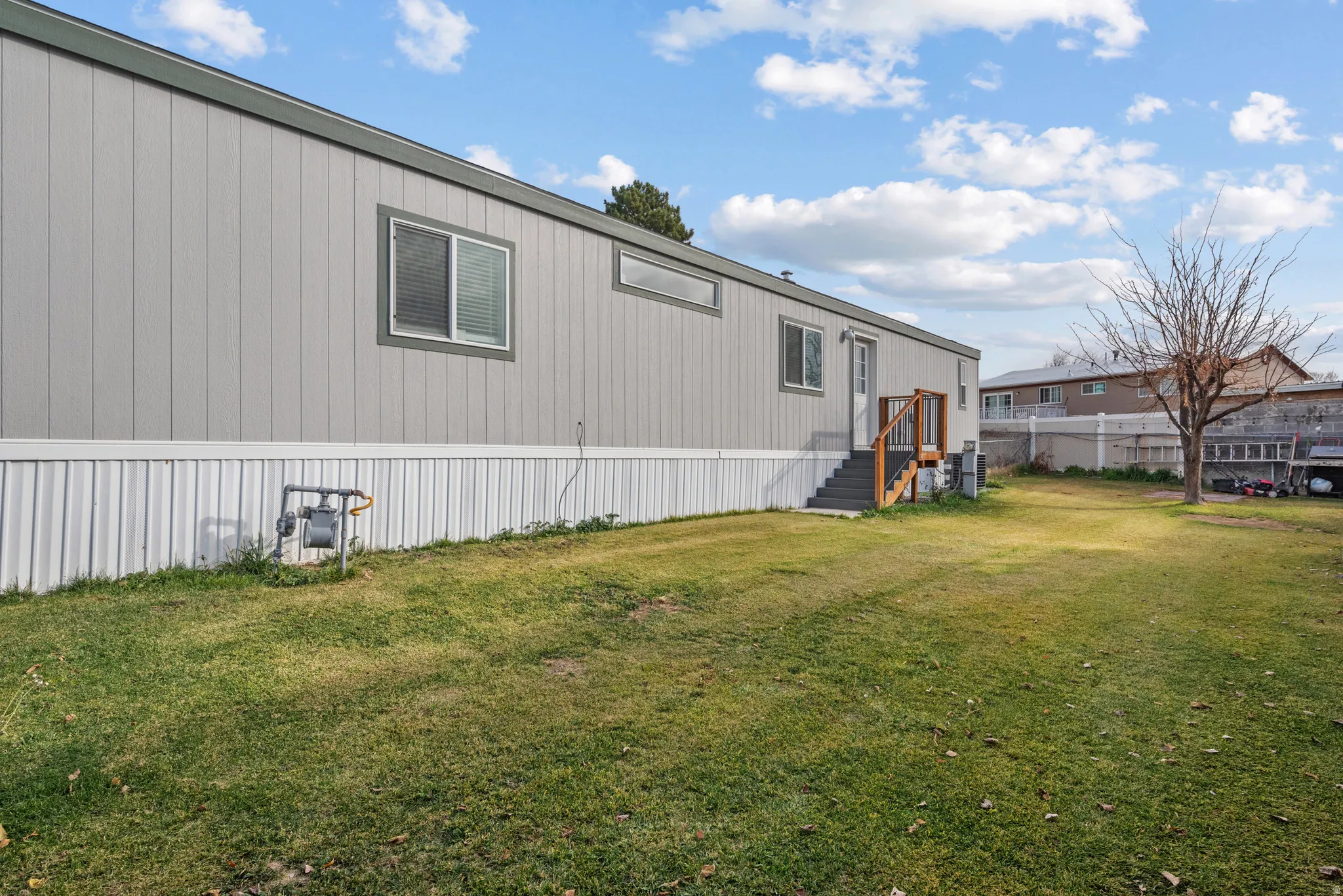 Property exterior featuring horizontal siding and multiple windows