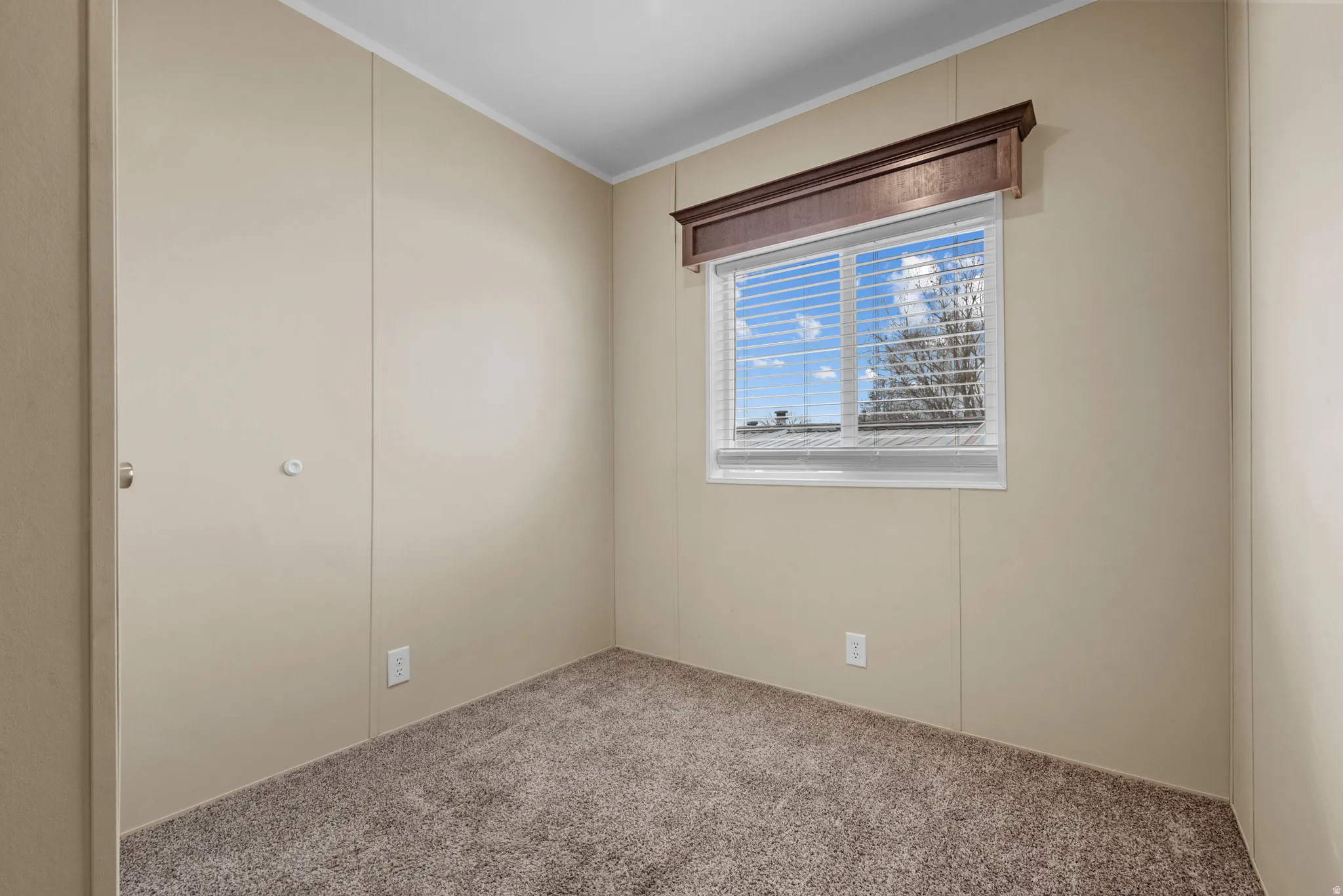 Neutral-toned walls with vertical paneling throughout
