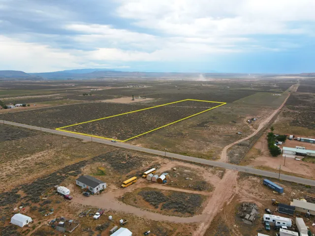 Expansive undeveloped land parcel with a clear boundary marking