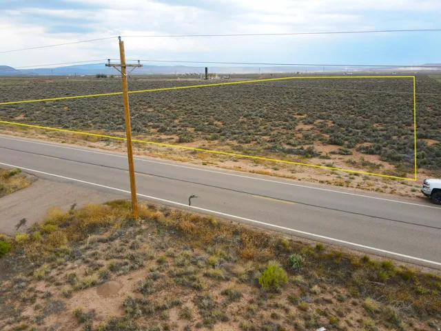 Expansive undeveloped land parcel with direct paved road frontage