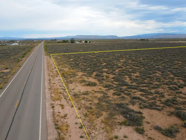 Expansive lot featuring a natural desert landscape and direct roadside access