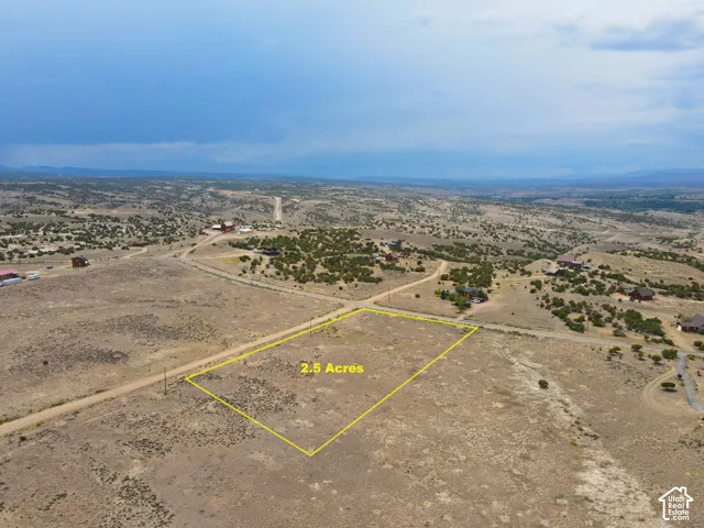 Expansive 2.5-acre lot featuring a flat topography and natural desert landscaping