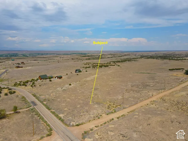 Expansive rural land parcel featuring a clear, open build site