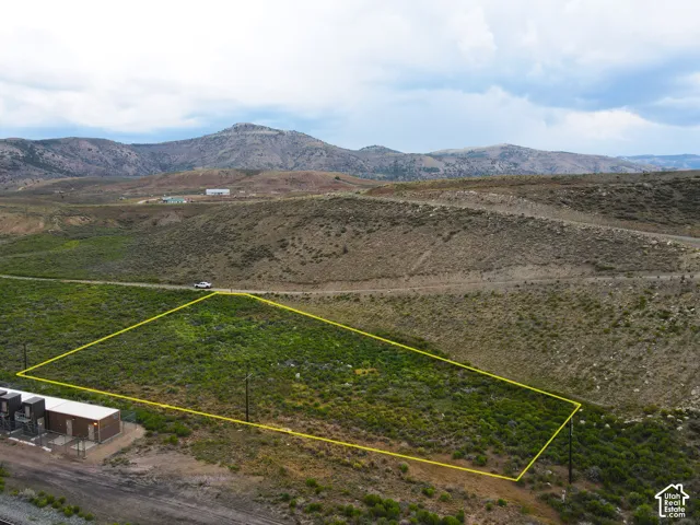 Expansive undeveloped land parcel featuring natural vegetation and rolling hills