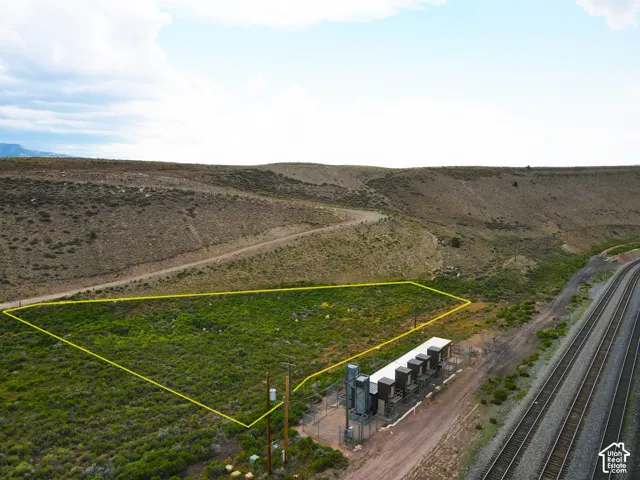 Expansive undeveloped land parcel featuring natural terrain and vegetation