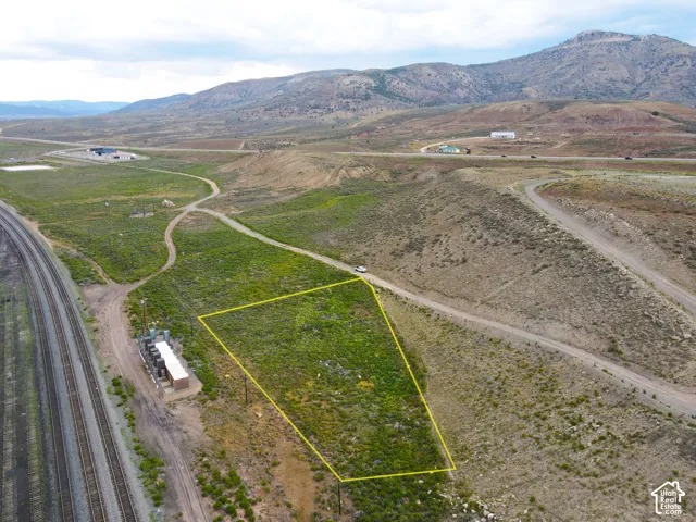 Expansive land parcel outlined in yellow, featuring varied terrain and natural vegetation