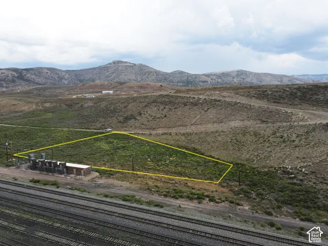Expansive undeveloped land featuring natural terrain with sparse vegetation