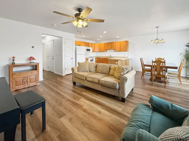 Open-concept living space featuring wood-finish flooring throughout