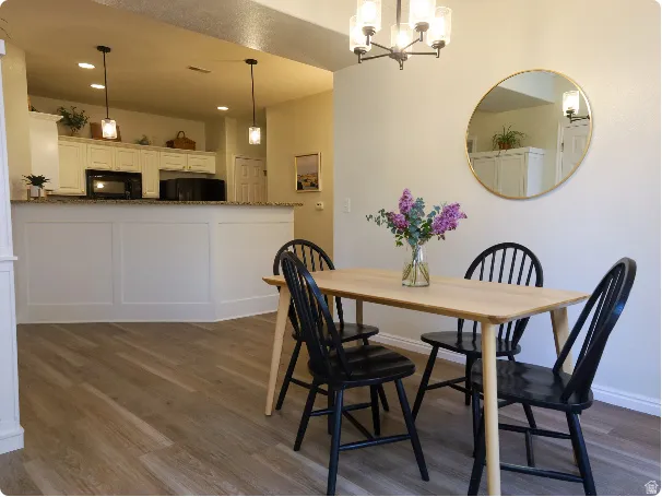 Open-concept living space featuring wood-finish flooring
