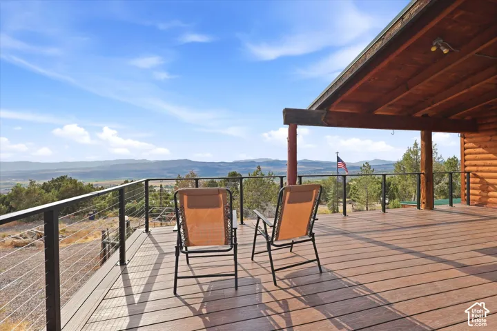 Deck features a new black cable railing system to allow full view of trees and valley