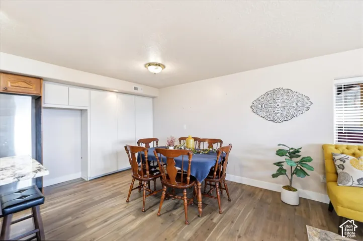 Dining area featuring a built-in pantry and a baker's shelf or freezer enclosure