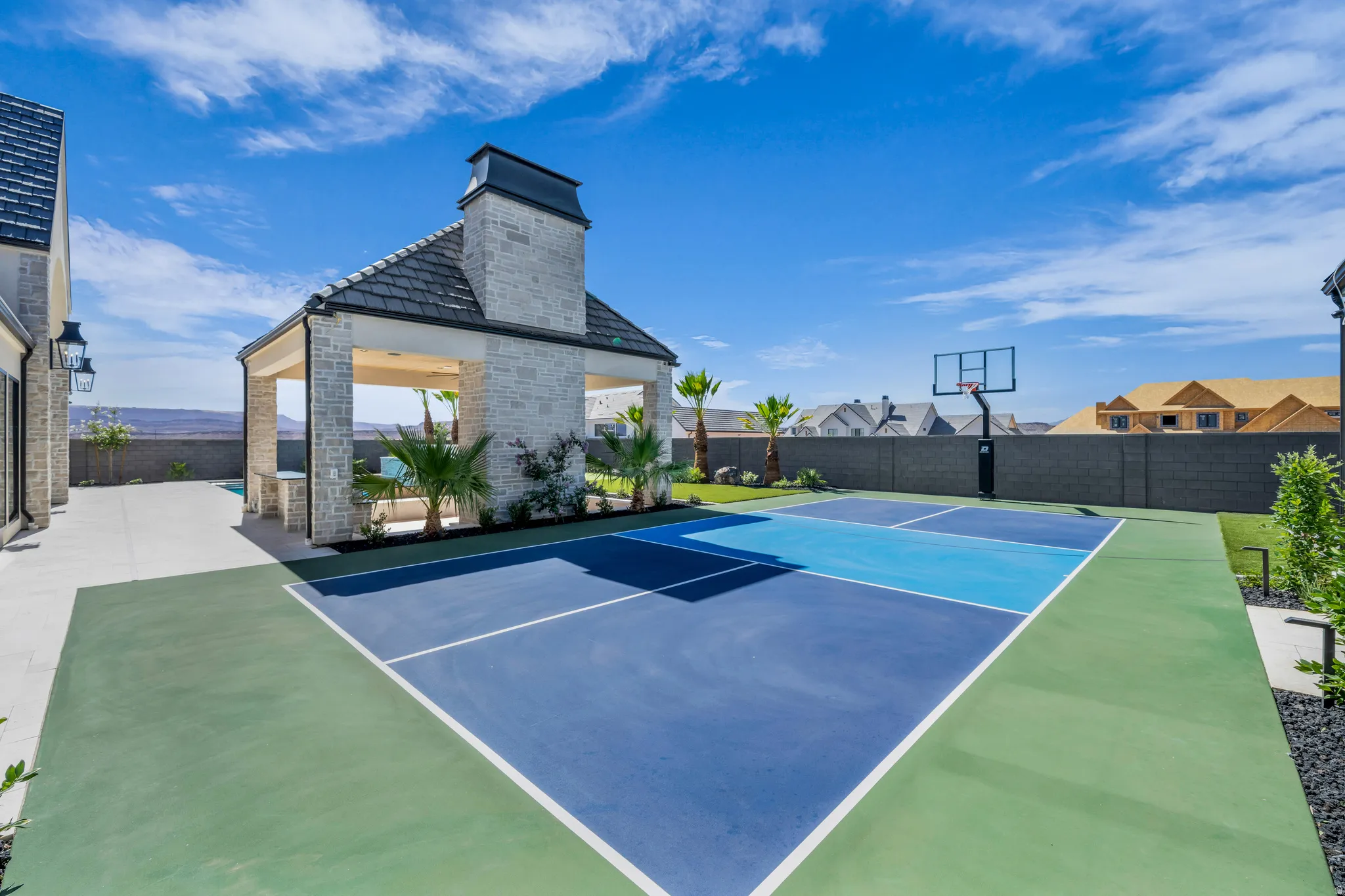 Multi-sport court featuring vibrant blue and green surfacing