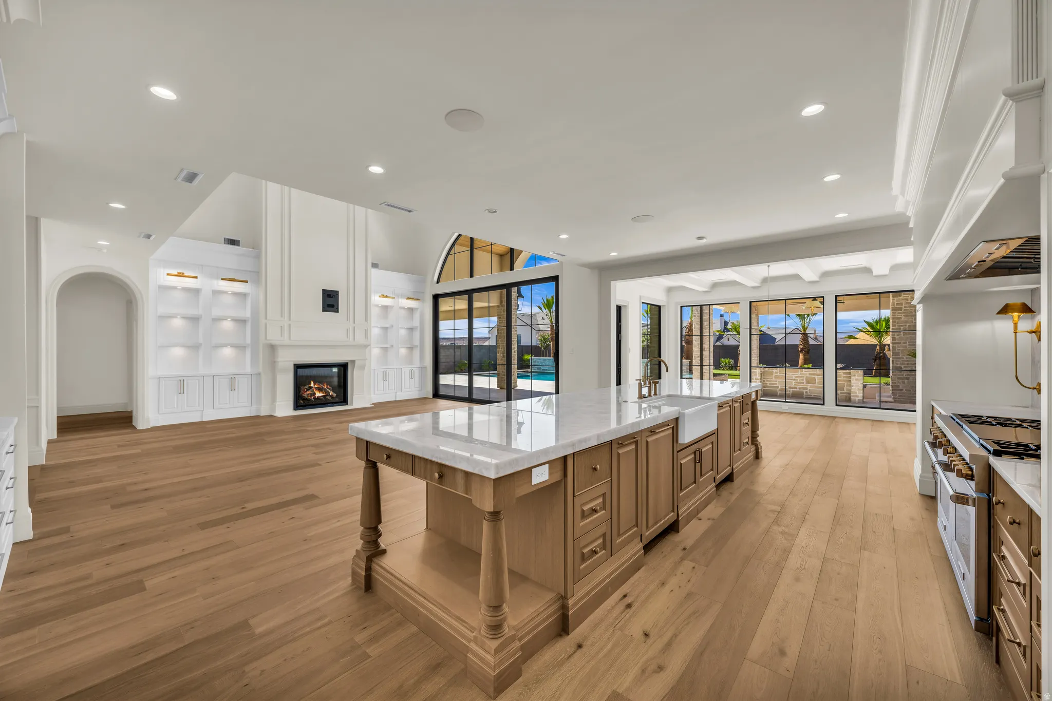 Spacious open-concept interior featuring light wood-finish flooring