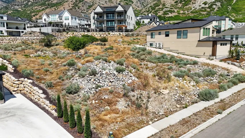 Curb and gutter and sidewalk in place, ready for your custom home design