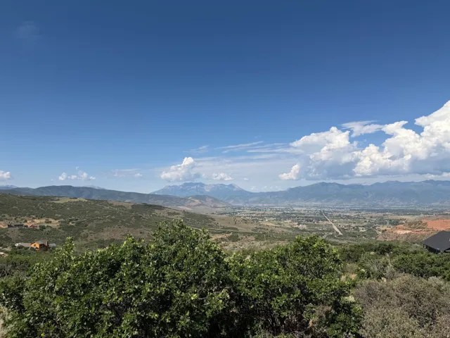 Expansive mountain and valley scenery under a clear sky