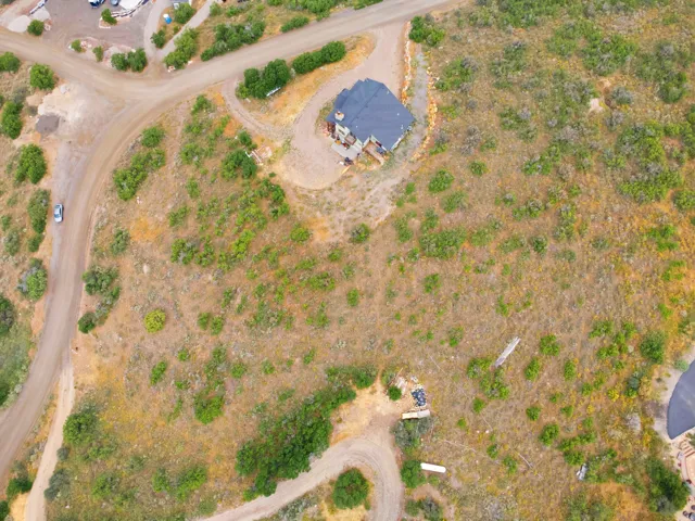 Single-family home situated on an expansive, undeveloped lot
