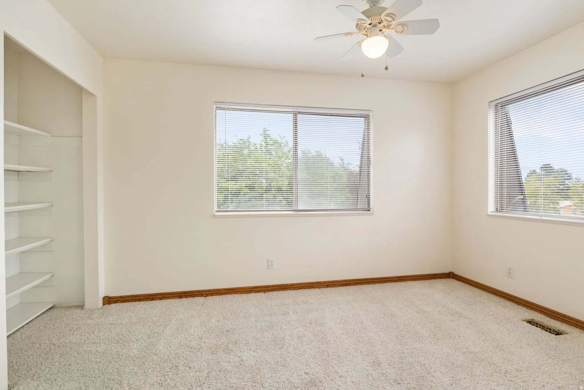 Bright interior space with light-colored walls and soft carpet flooring
