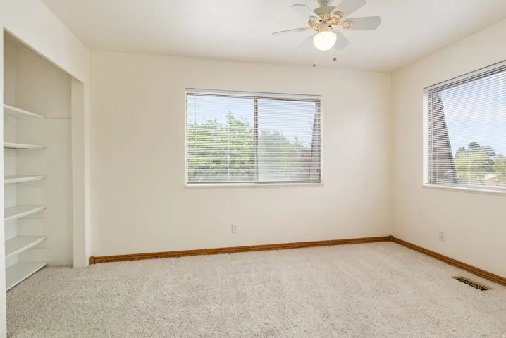 Bright interior space with light-colored walls and soft carpet flooring