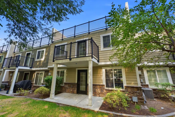 Townhome with a large rooftop deck, a private primary suite deck, and back patio.