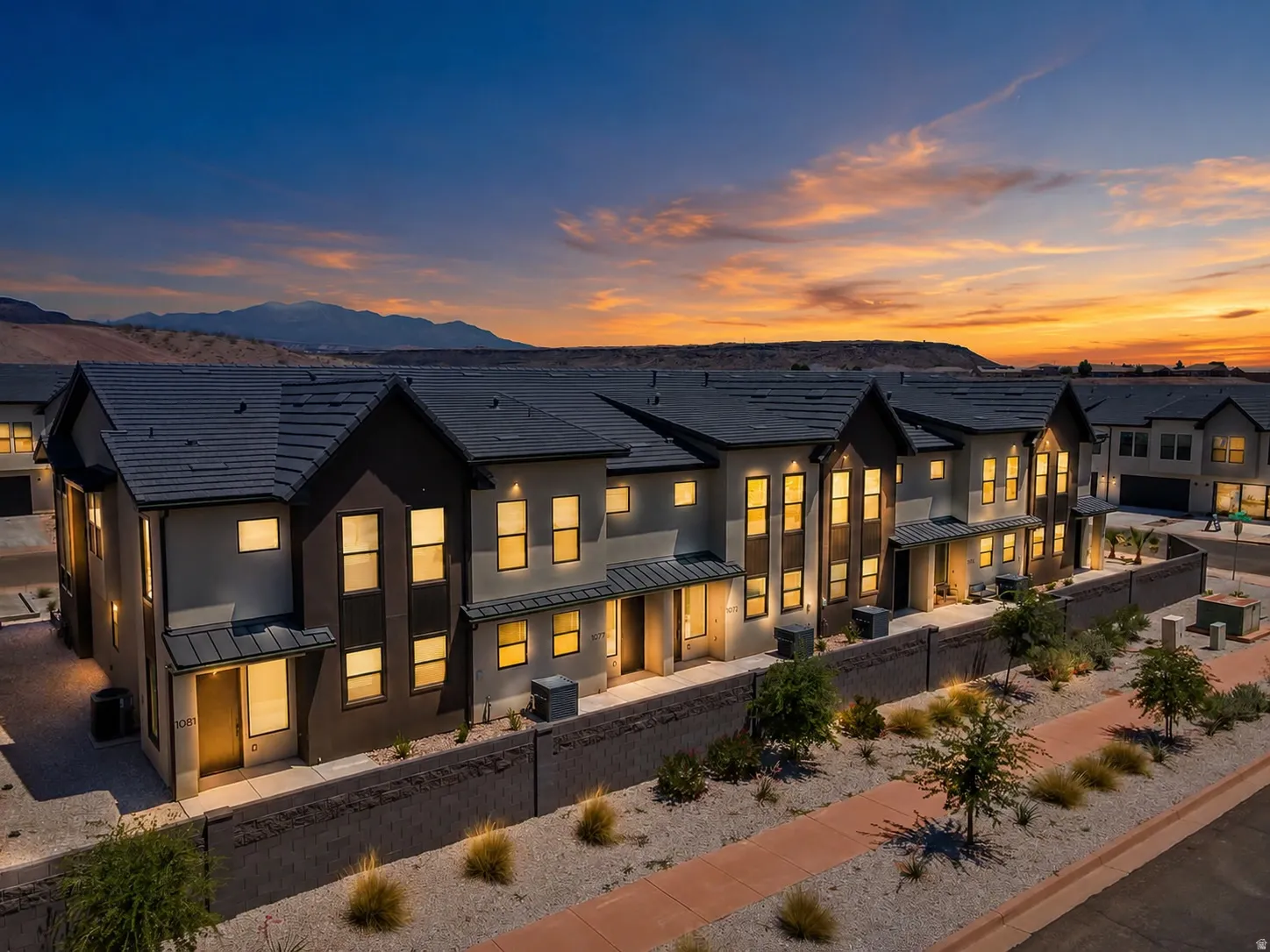 Modern townhomes featuring multi-tone facades and dark-tiled roofs
