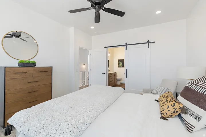 White walls featuring recessed lighting and a ceiling fan