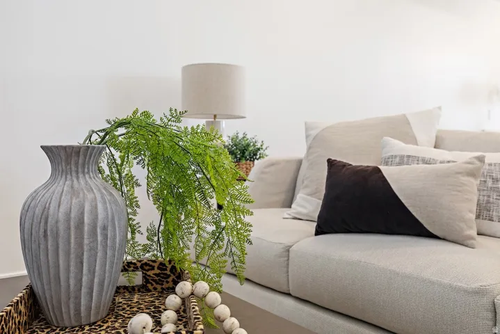 Light-toned sofa featuring geometric accent pillows
