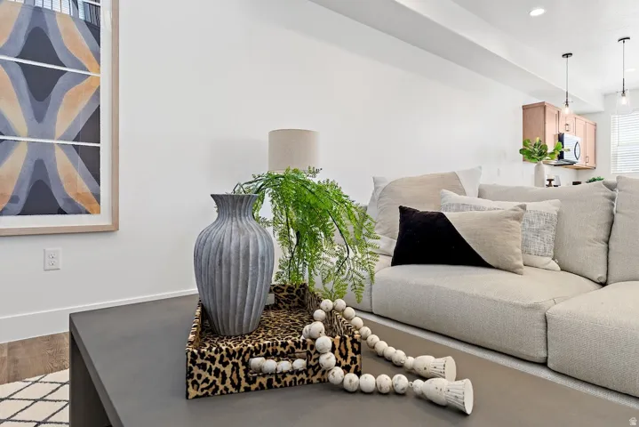 Recessed ceiling lighting illuminates the open-concept living area