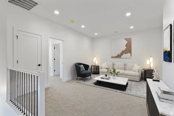 Bright upper-level bonus room featuring recessed lighting, a neutral color palette, and soft carpeting