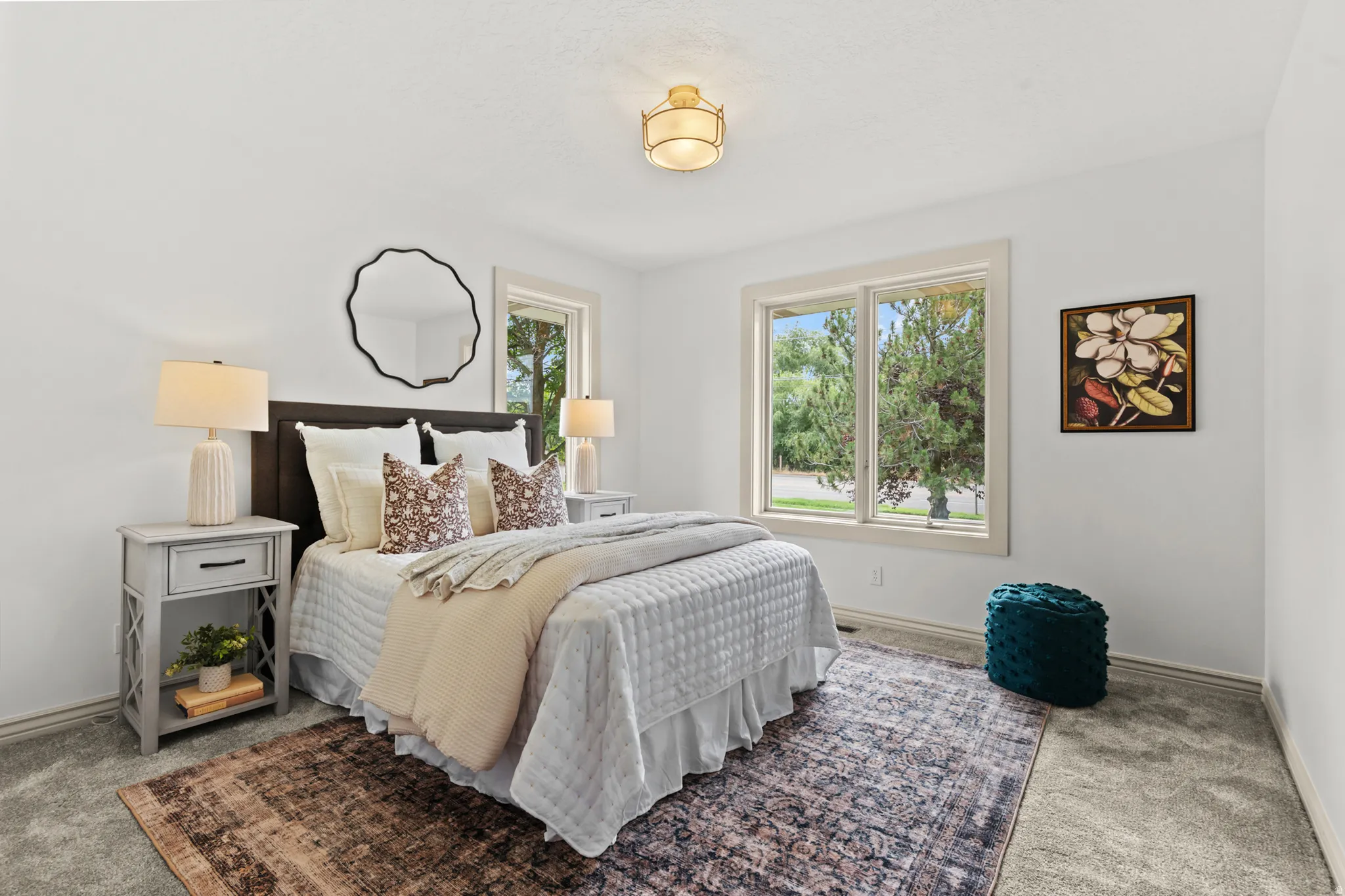 Bedroom featuring light gray carpeting, neutral wall color, and a flush-mount ceiling light fixture