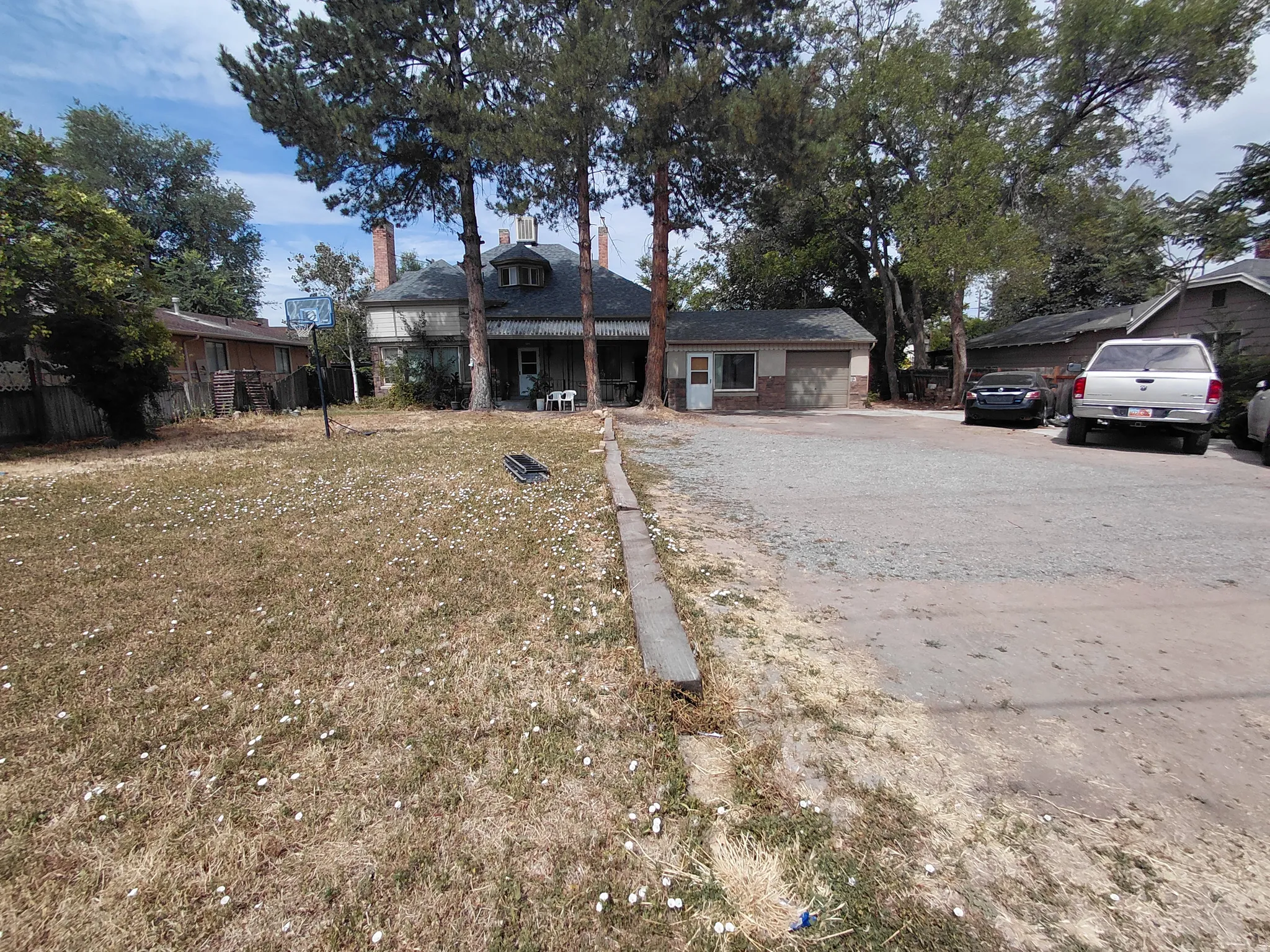 Single-story auxiliary structure with brick and siding exterior