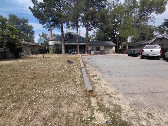 Single-story auxiliary structure with brick and siding exterior