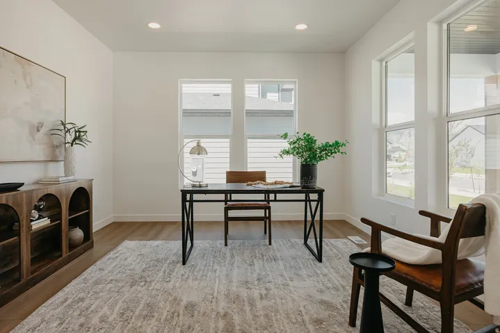 Bright interior space featuring wood-finish flooring and recessed lighting