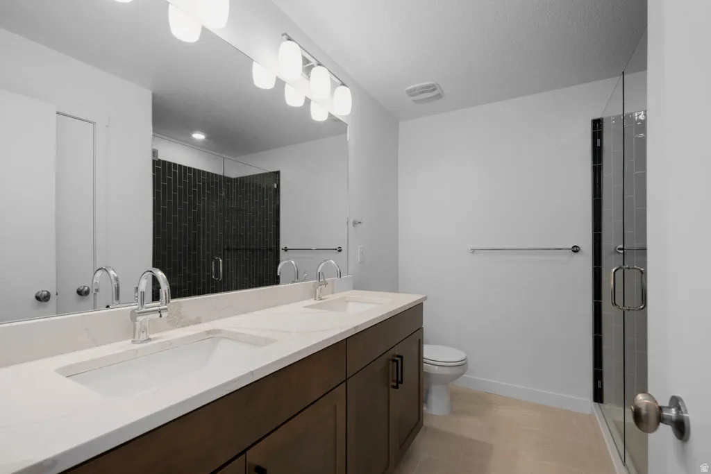 Double vanity with integrated sinks and a light-toned countertop