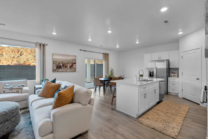 Open concept living space with wood-finish flooring