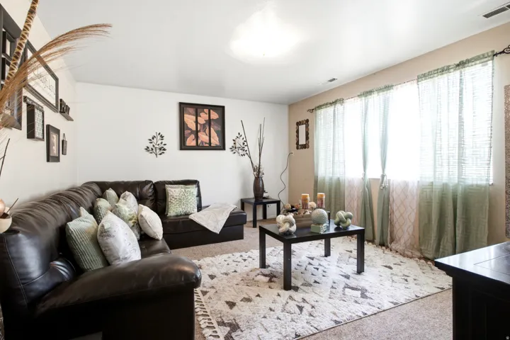 Bright interior space featuring a recessed ceiling light and carpeted flooring