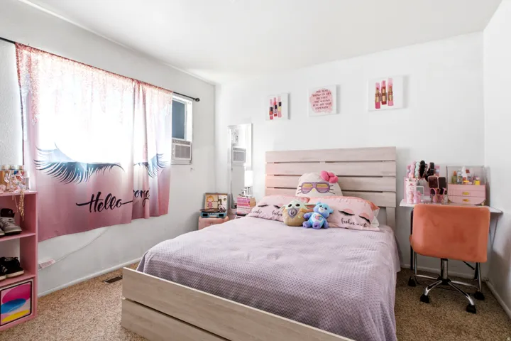 Bedroom featuring wall-to-wall carpeting and white painted walls