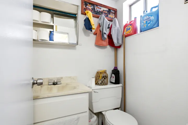 White-painted interior space with a window