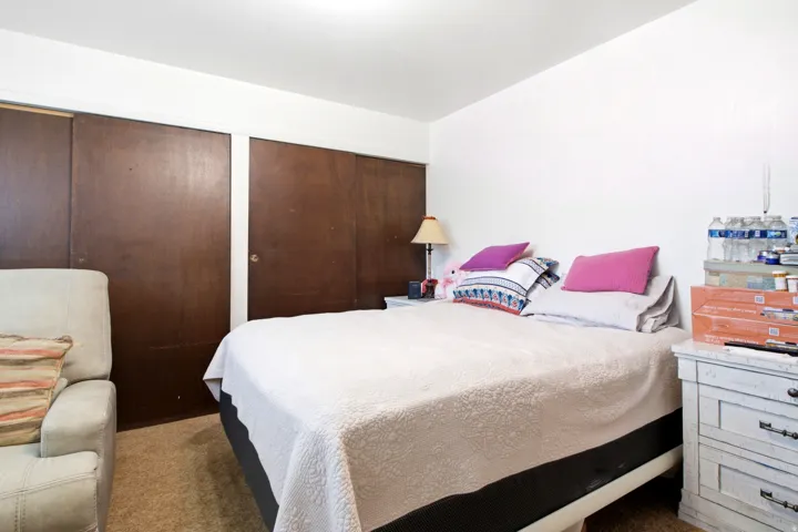 White walls with recessed lighting and a carpeted floor