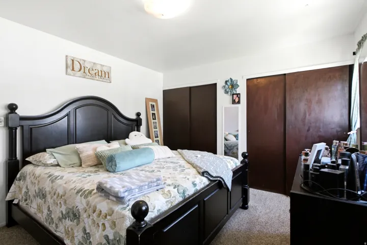 Bedroom featuring light-colored walls and soft carpet flooring