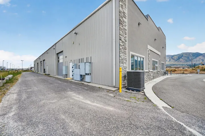 Commercial building with a combination of corrugated metal siding and stucco finishes