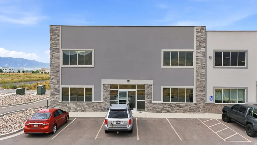 Modern commercial facade featuring a stone veneer and stucco exterior