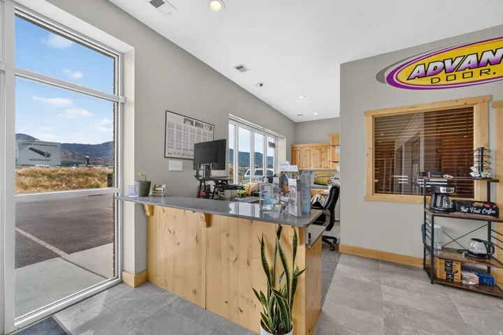 Reception area featuring a wood-panel counter with a gray countertop