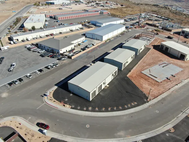 Aerial view of commercial property featuring multiple metal-clad structures