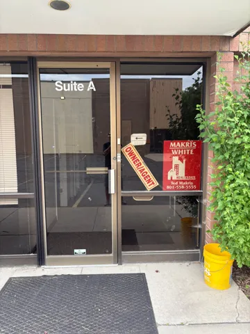 Glass entry doors with brushed metal framing