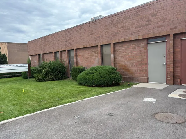 Brick-clad commercial building with multiple windows