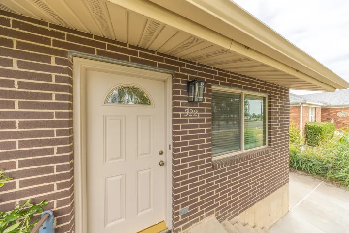 Brick exterior with light-colored siding soffit